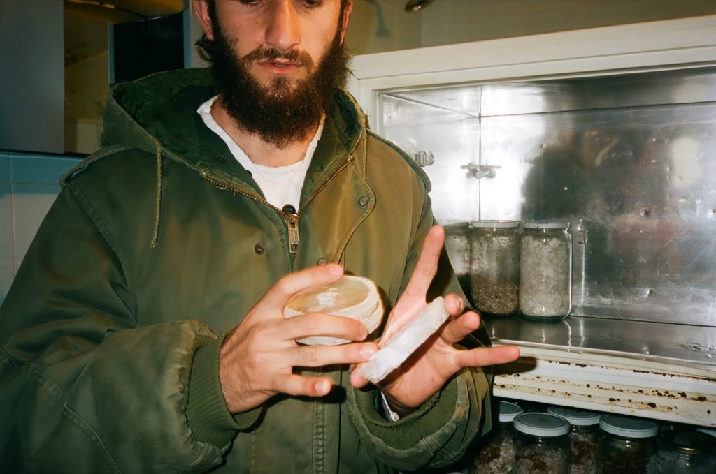 Bahaa showing how he grows funghi Shot with a Yashica T5 on Kodak Portra 400, 35mm © Thalia Bassim