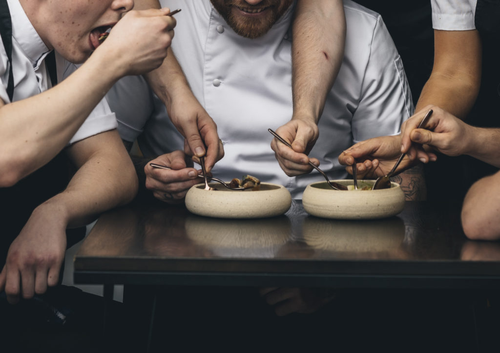 The kitchen team at Tom Brown's Cornerstone restaurant (Holland Harvey, 2022)  in London's East End. Photo (detail) © Lateef Okunnu, courtesy Holland Harvey.