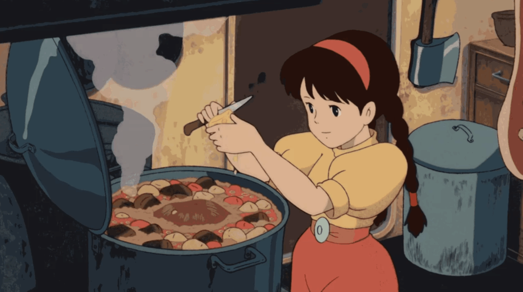 A still of the character Sheeta making a stew in a large cauldron from the Studio Ghibli film Castle in the Sky.