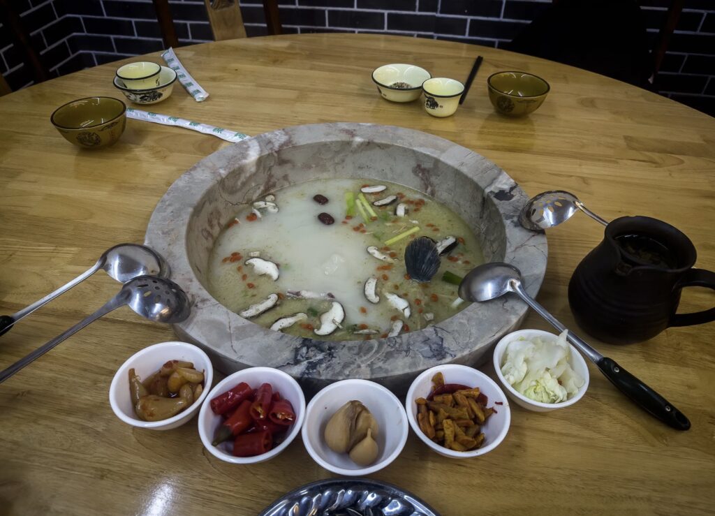 Traditional Stone Pot Fish dish in Yunnan