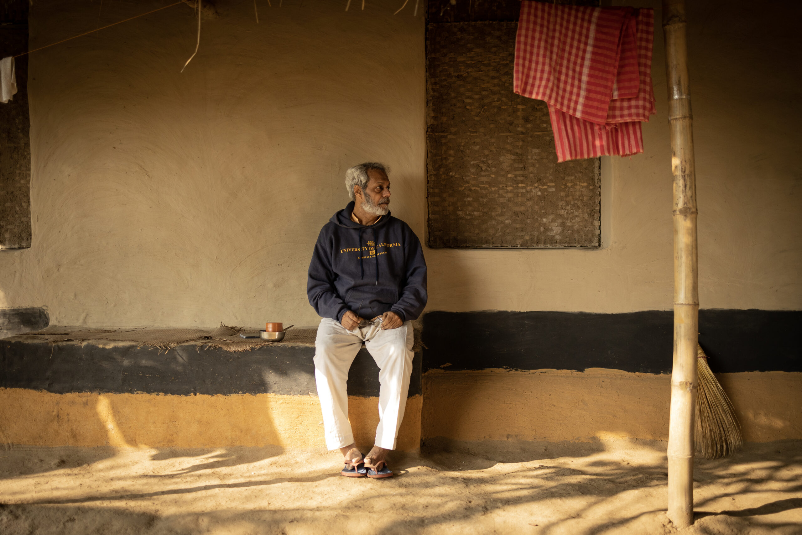 Dr Debal Deb sitting on a bench