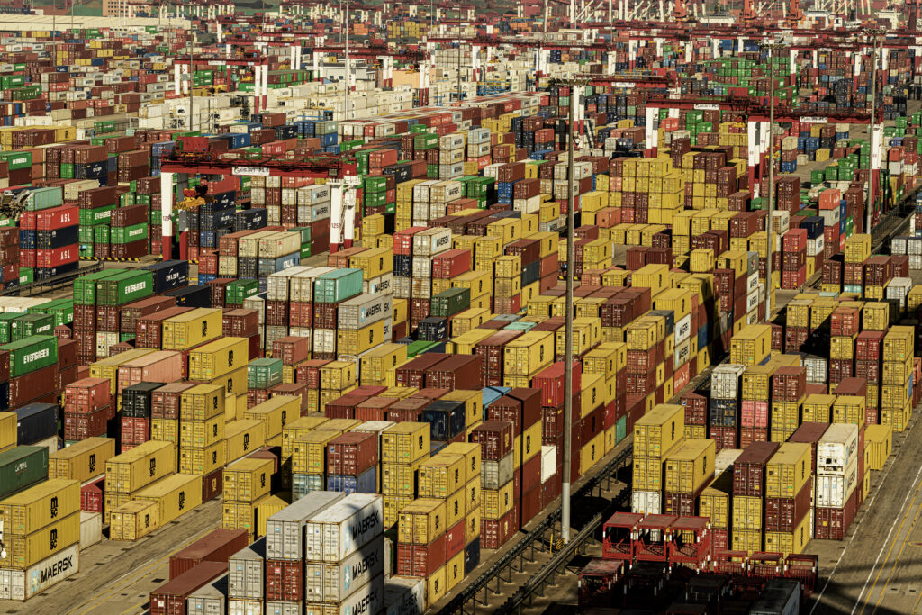Aerial view of the Qingdao container port with hundreds of containers.