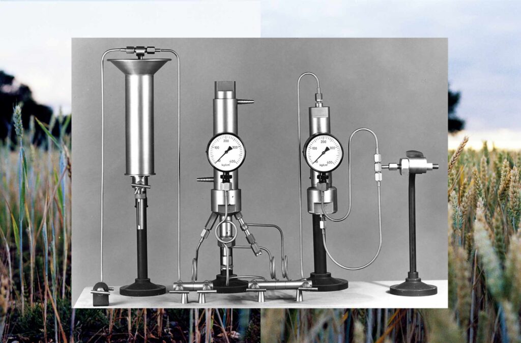 Collage of two trial plots of the Broadbalk field experiment (the one on the left receiving no fertiliser with the one on the right receiving high levels of fertiliser) over an archive photograph of the test apparatus used by Frans Haber to develop his famous Haber-Bosch method of chemically synthesising nitrogen-based fertiliser. Image © and courtesy of Crystal Bennes
