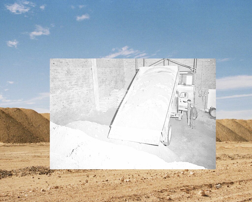 Commercial phosphate fertiliser dumped in a Yara factory storage warehouse, Landskrona, Sweden, over the mountainous spoil heaps (“waste” left behind after mineral processing) of the Bou Craa phosphate mine in Western Sahara. Image © and courtesy of Crystal Bennes